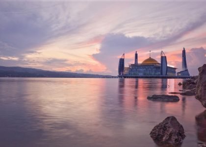 Beautiful sunrise in the middle of the sea mosque which is the landmark of Kendari city, Southeast Sulawesi